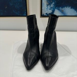 Schutz pointed toe black leather booties.